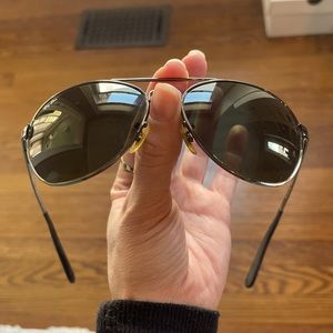 Ray Ban gunmetal gray and black gradient lens aviator sunglasses.